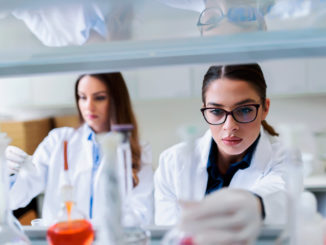 Young female researchers conducting laboratory test.