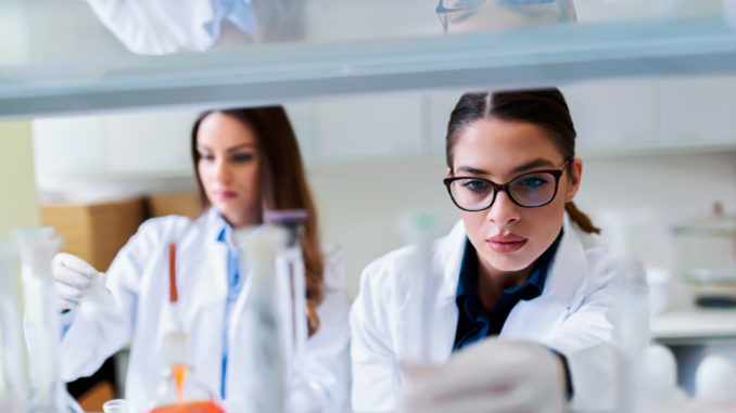 Young female researchers conducting laboratory test.