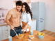 Happy hot couple together in kitchen