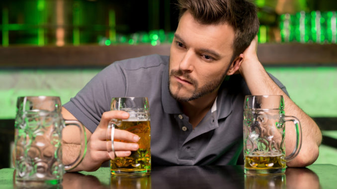 young man drinking beer