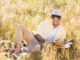 Happy man reading a book on a sunny day