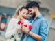 Romantic Man giving flower and gift box to women for Valentines day