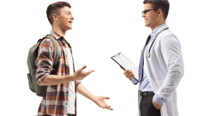 Male student talking to a doctor Male student talking to a doctor