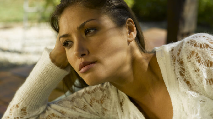 Close-up of a young woman thinking.