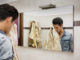 Reflection of Young Man Drying Face with Towel in Mirror as Part of Daily Hygiene Routine