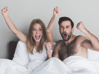 Portrait of young men and women cheering