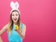 Young woman with Easter theme on a pink background