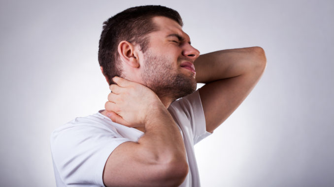 Young exhausted man with strong neck ache isolated on white background