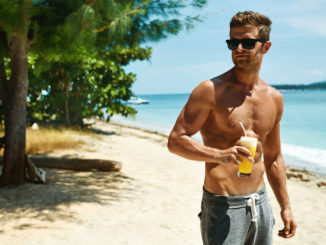 Healthy Drink. Handsome Fitness Male Model Having Fun