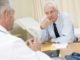 Man in doctor s office frowning