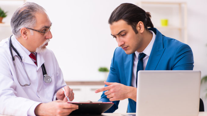 Young businessman meeting with the old doctor