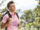 Middle Aged Man Hiking Through Countryside