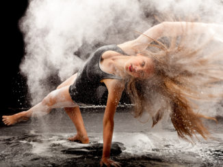 a female dancer in a cloud of white powder