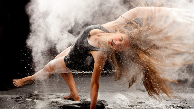 a female dancer in a cloud of white powder