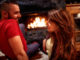 Young couple in love at home front of fireplace
