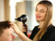 Woman Hairdresser Drying Male Hair with Hairdryer.