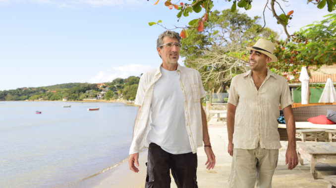 Two men walking and talking