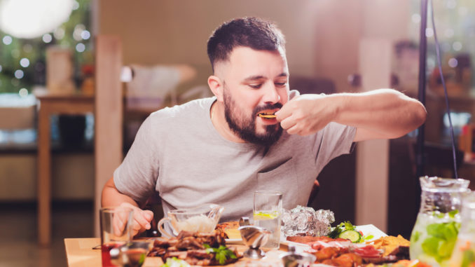 Man at the big table with food