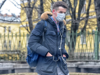 People in medical masks on the streets of the city during the coronavirus epidemic