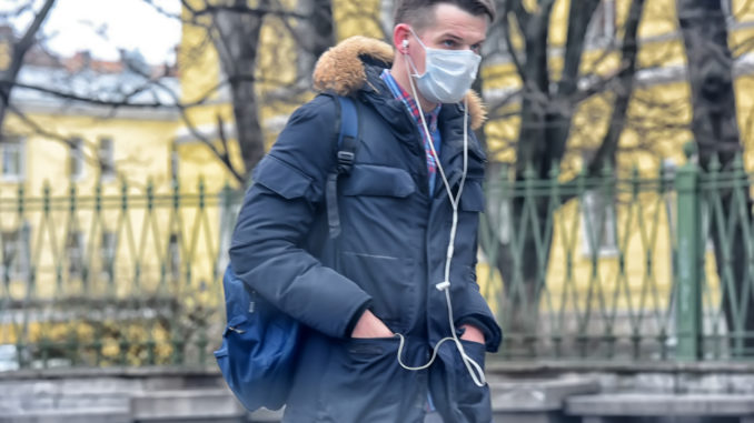 People in medical masks on the streets of the city during the coronavirus epidemic