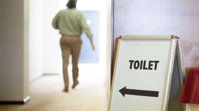 Man going to public toilet