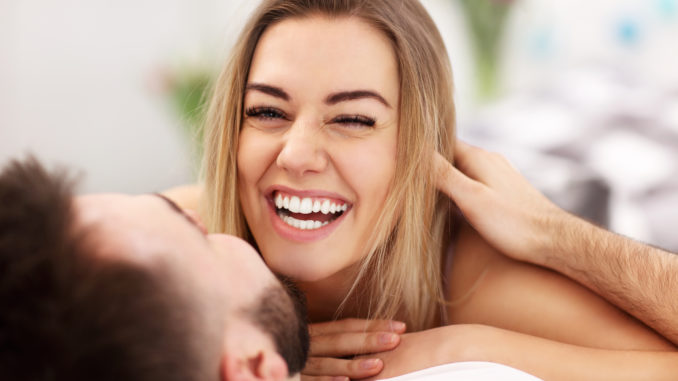 Adult attractive couple in bed