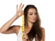 Young woman is thrilled by the length of the measuring tape