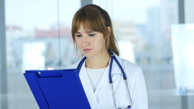 Close Up of Female Doctor Reading Medical Reports,4k , high quality