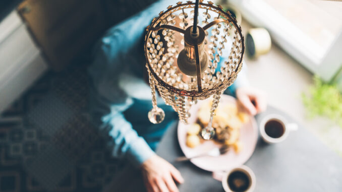 Breakfast at the oval table by the window.