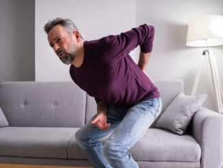 Older Senior Man With Back Pain Or Backpain