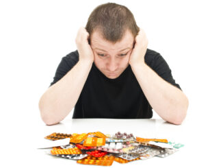 Man and medicines on a white background