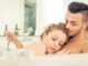 Young happy successful couple enjoying an hot bath in the jacuzzi