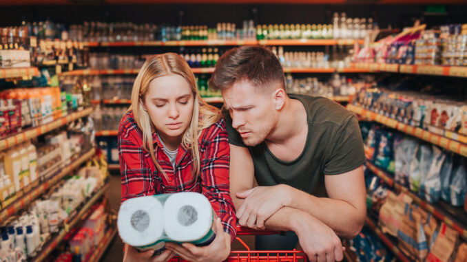 Young couple in grocery store.