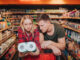 Young couple in grocery store.