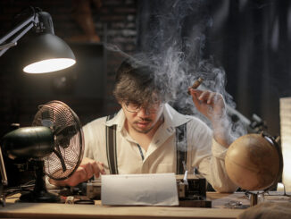 Stressed Man Smoking Cigar to Find Inspiration