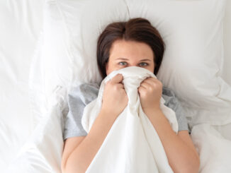 young beautiful woman in bed