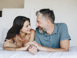 Couple spending their honeymoon in bed