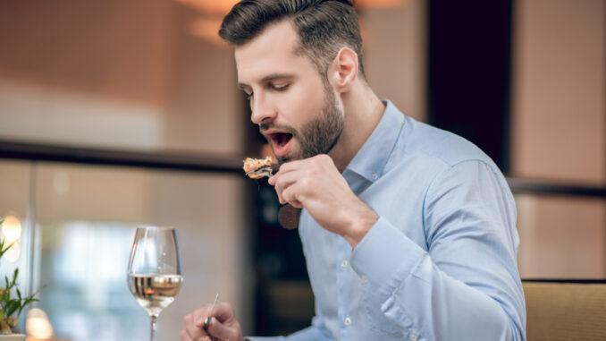 Man eating seafood at the restaurant