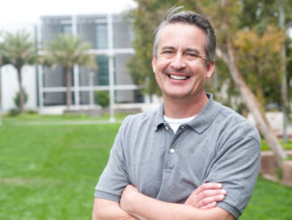 Casual portrait of a mature, happy man taken outside