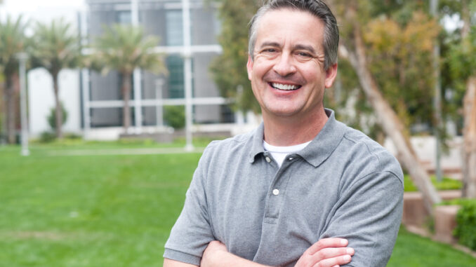 Casual portrait of a mature, happy man taken outside