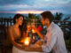 Young couple enjoying a romantic dinner by candlelight, outdoor