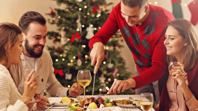 Picture showing group of friends celebrating Christmas at home