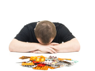 Man and medicines on a white background