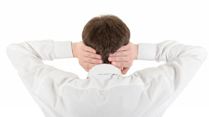 Rear View of Young Man Covering his Ears.