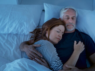 Senior men and women sleeping and dreaming together in a deep sleep.